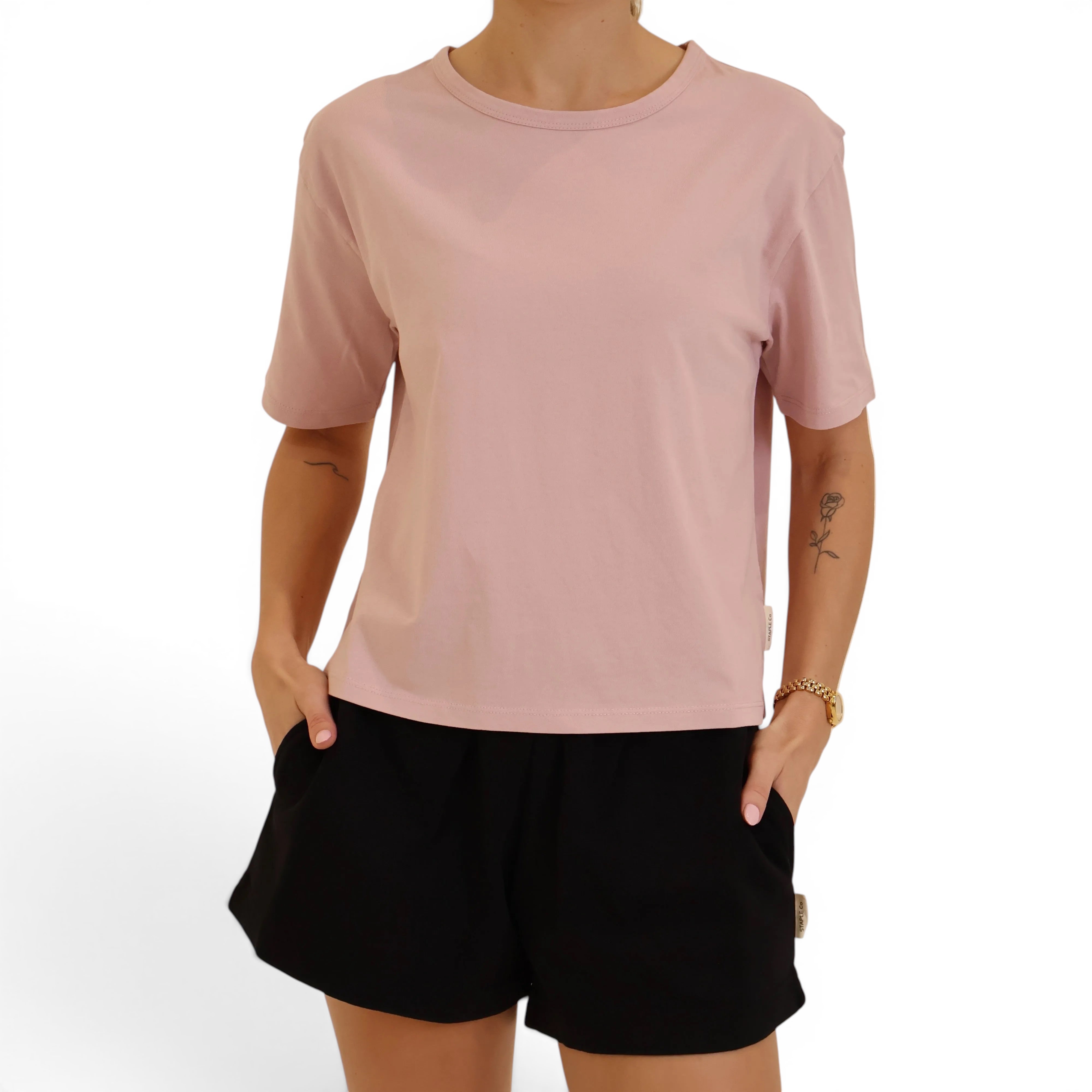 Pink boxy tee with black organic cotton shorts
