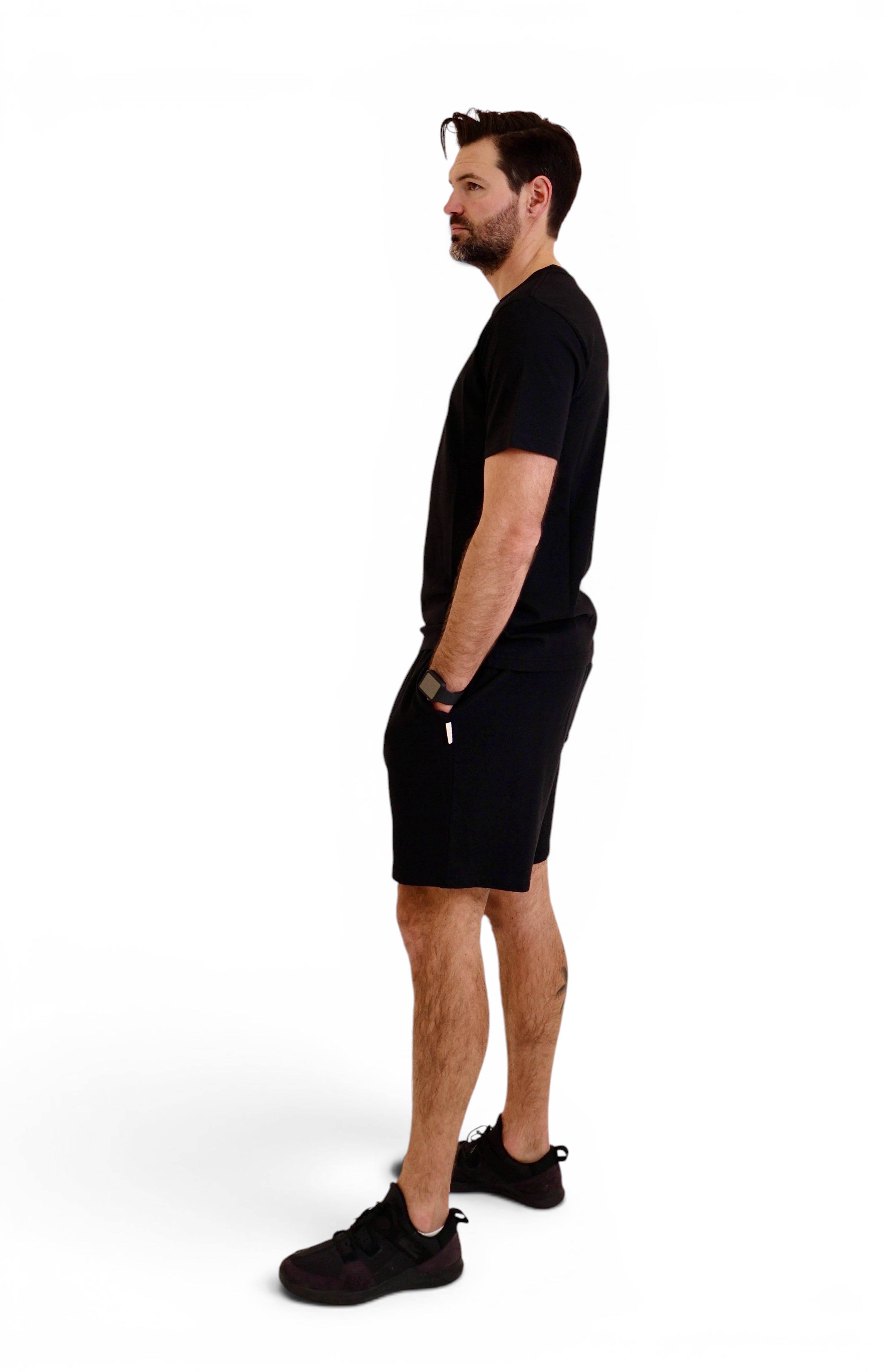 Man wearing black t-shirt and shorts