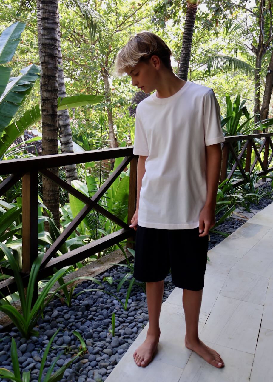 Regenerative Organic Certified T-shirt for Children in Pinkish and black shorts