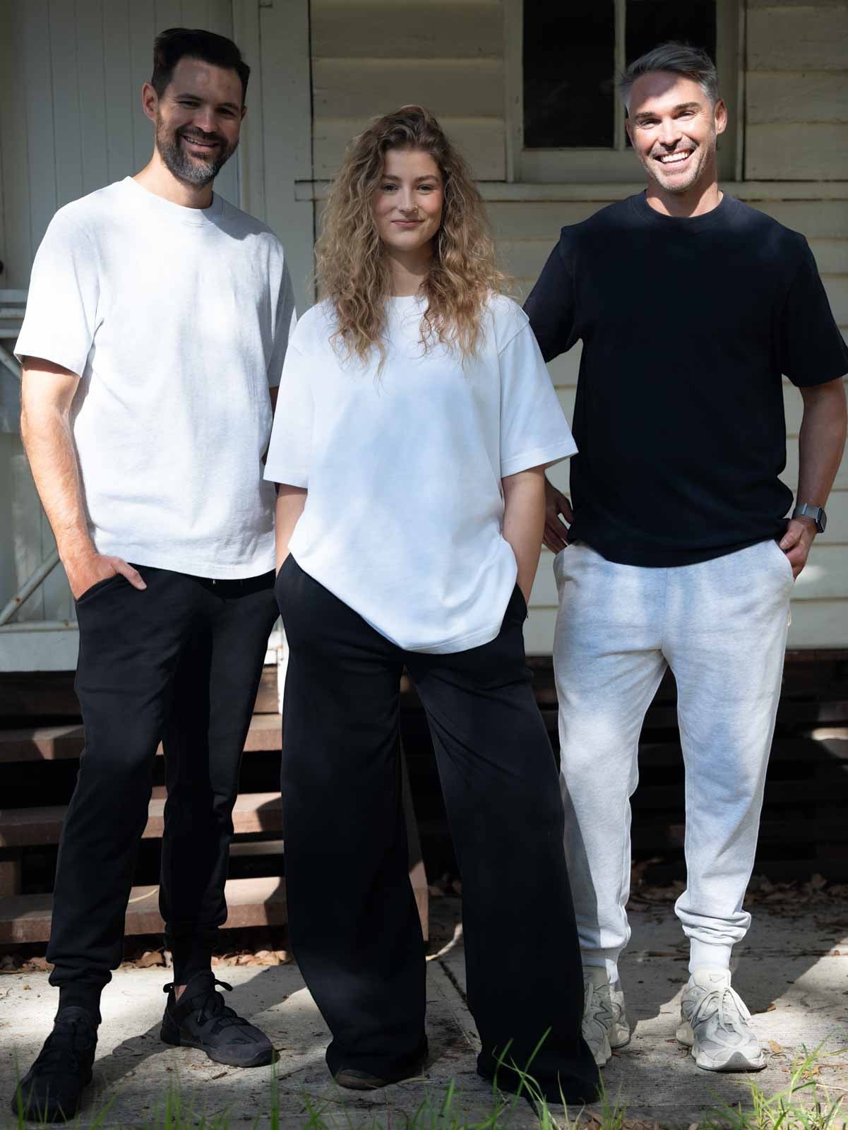 Three people wearing STAPLE CO organic cotton essentials in everyday life