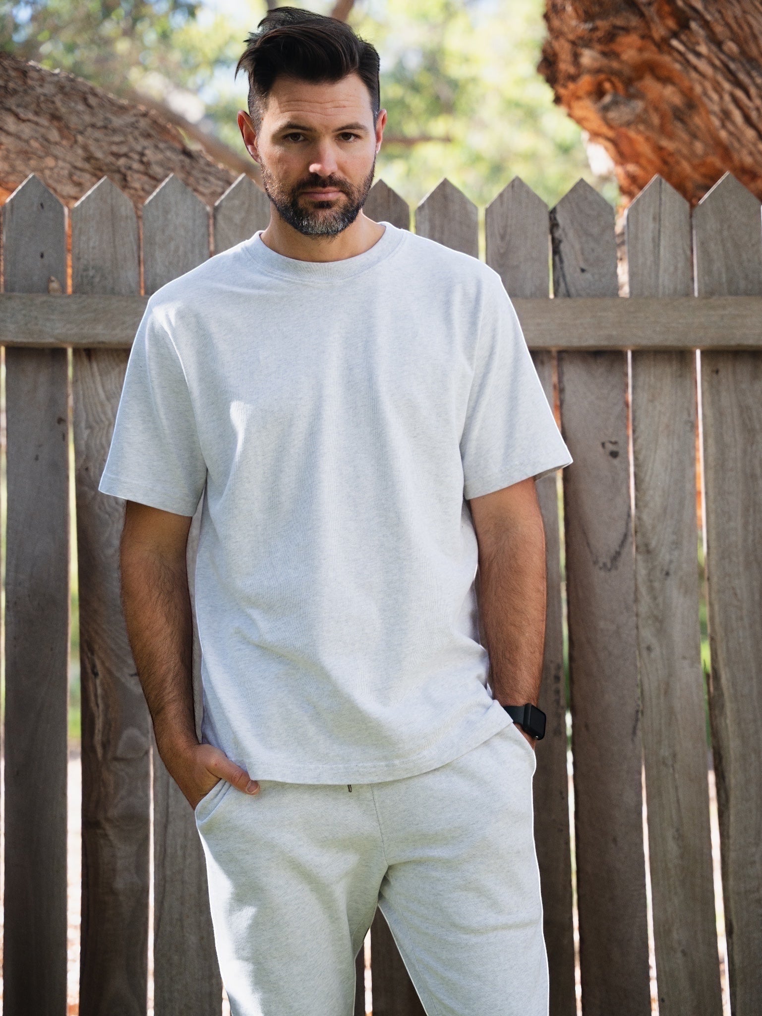 Man wearing a STAPLE CO organic cotton tee made by certified manufacturing partners in India