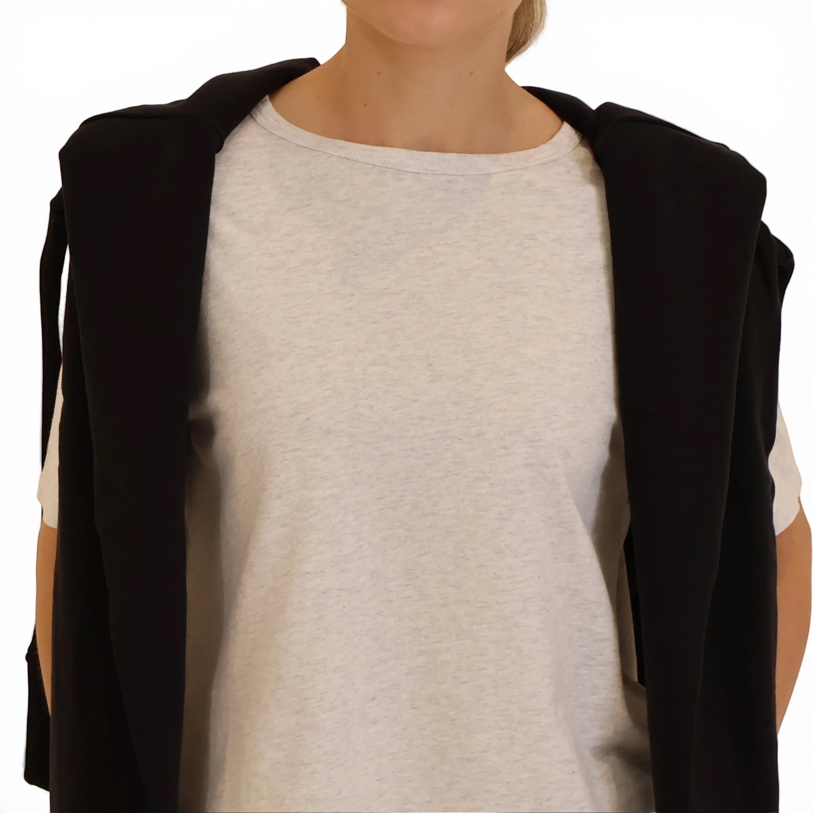 Grey boxy tee close up with sweater over the shoulders