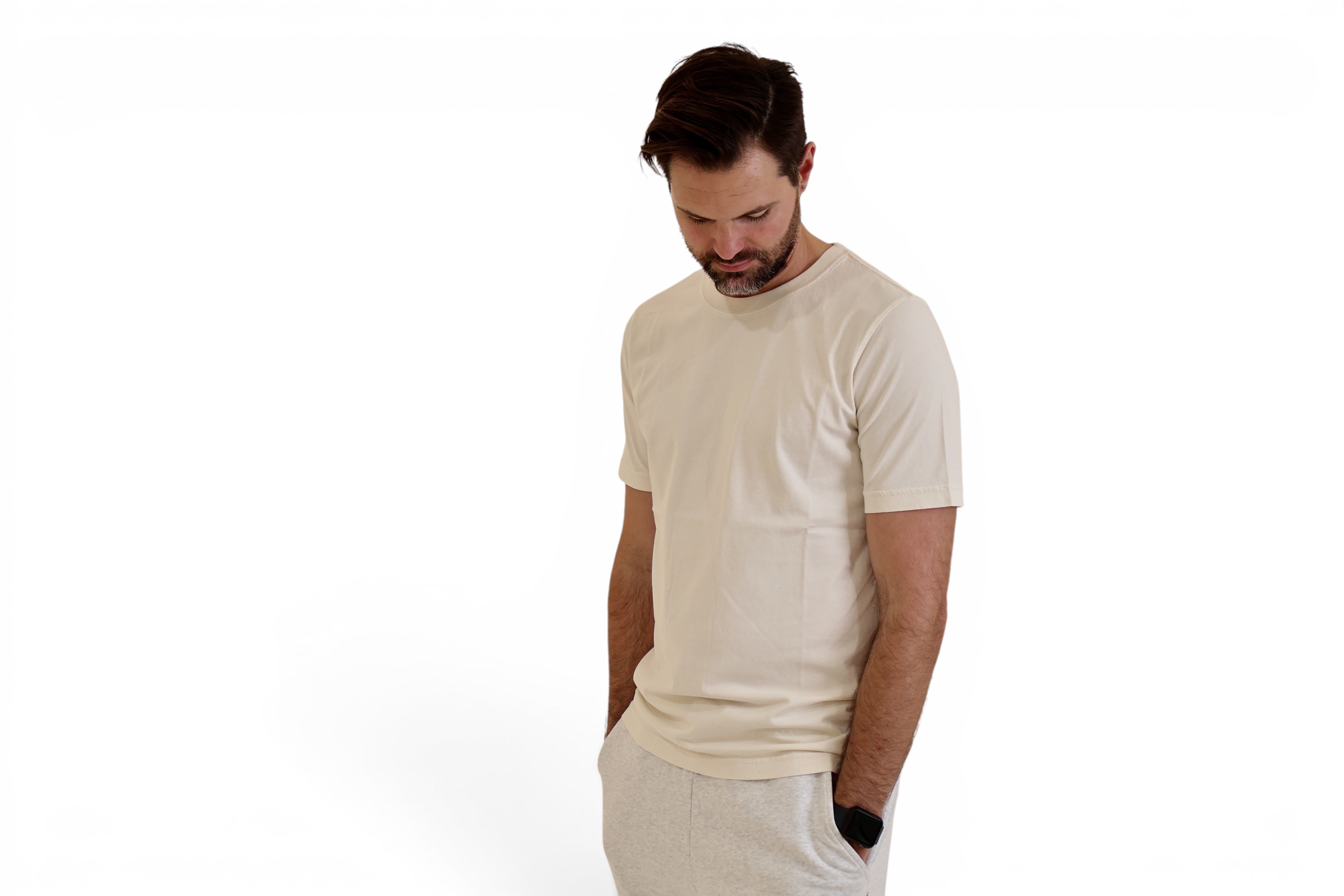 Man wearing STAPLE Co natural raw t-shirt with trackpants