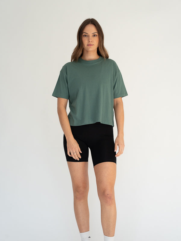 Model wears the organic cotton boxy t-shirt in green