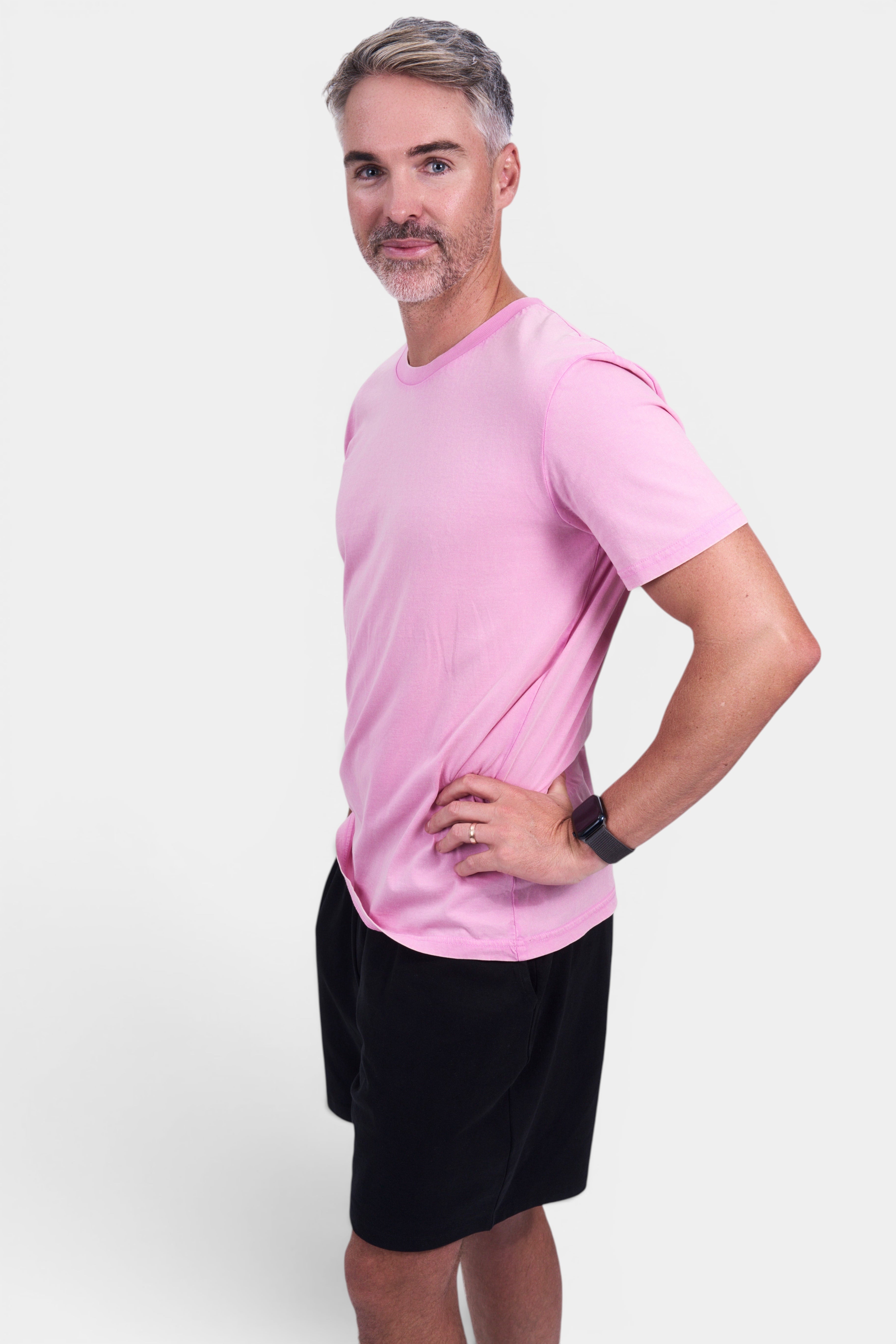 STAPLE Co pink organic cotton classic fit tee on a man wearing black shorts. Final sale.